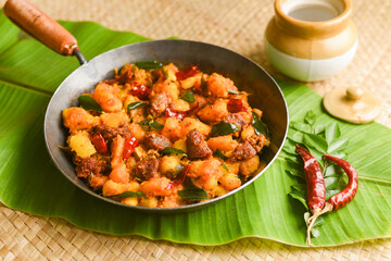 Kappa Biryani Cooked tapioca and spicy meat curry , Cassava root , Mandioca or Aipim,  Kerala special Kappa Puzhukku South Indian food  beef tapioca, India. with Fish curry. root vegetable Brazil