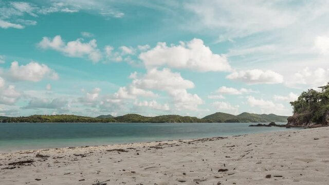 Low Angle Timelapse Of Clouds And White Beach On An Island In Palawan Philippines