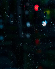 rain drops on the window with bokeh refelctions