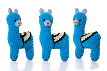 Knitted toy. Blue lama on white background. Three position. Full depth of field. With clipping path.