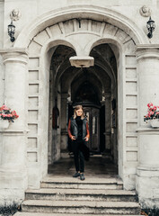 woman standing in the arch old historical temple fortress building church 