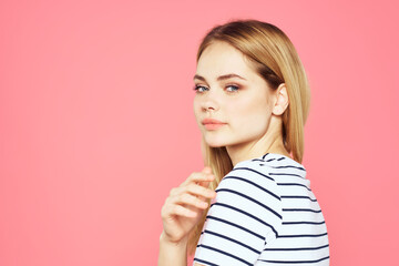 Woman in striped t-shirt emotions studio cropped view lifestyle pink isolated background