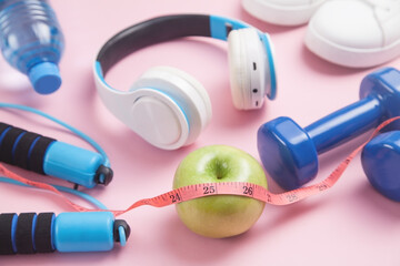  Measuring tape, apple and fitness equipments.