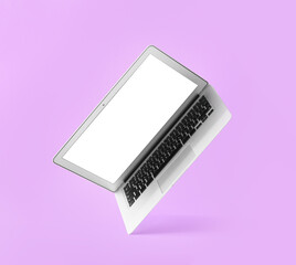 Modern laptop on color background