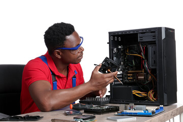 African-American technician repairing computer on white background