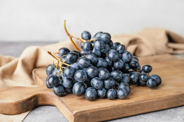 Sweet ripe grapes on table
