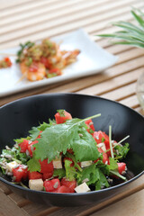 Greek salad with feta cheese, green peppers, black olives, tomatoes. Ideas for summer, light and fast lunch. Nutritious and complete food.