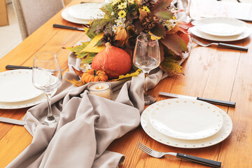 Beautiful table setting for Thanksgiving Day celebration in dining room