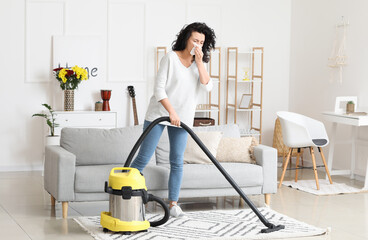 Allergic woman cleaning her flat