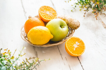Basket with fresh fruits and ginger