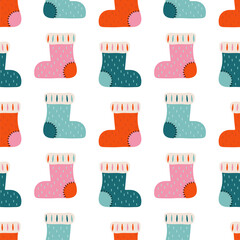 Warm knitted winter socks seamless pattern. Vintage background with festive Christmas stockings. Warm winter clothing. Scandinavian style for kids fabric. Christmas icons, elements and illustrations.