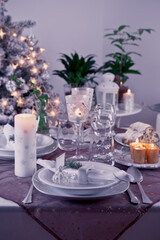Table setting for celebration Christmas and New Year Holidays. Festive table at home.