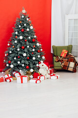 Fototapeta na wymiar Christmas tree pine decor presents new year house red background