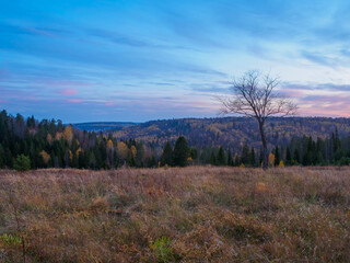 Panorama of autumn Stone Hill park in sunset light.