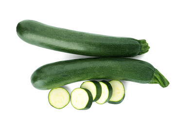 Cut and whole green ripe zucchini isolated on white, top view
