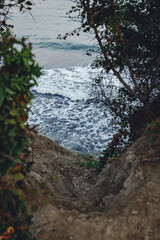 descent to the sea, cliff, waves on the beach