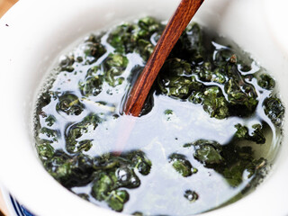 Chinese green tea is brewed in ceramic gaiwan