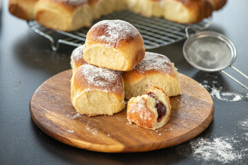 Sweet bread rolls with cherri filling and powdered sugar on top