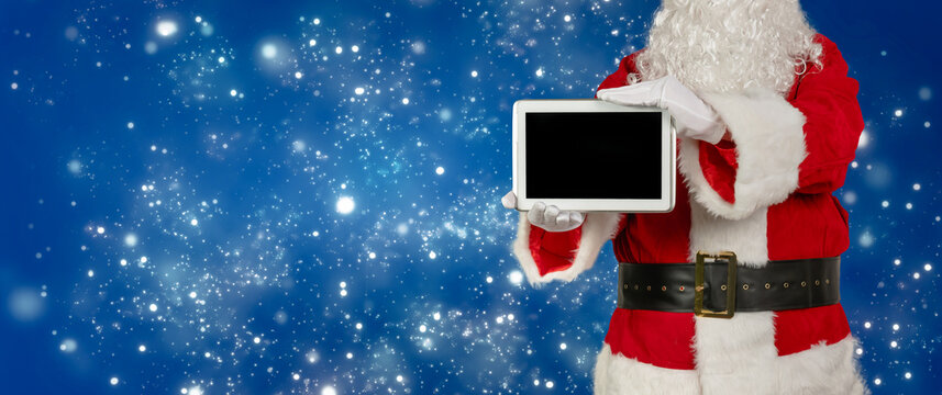 santa holds an blank tablet for advertising in the camera