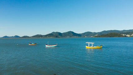 Fototapeta na wymiar Fisherman boat on the coast, aerial image from Florianópolis, Santa Catarina Brazil