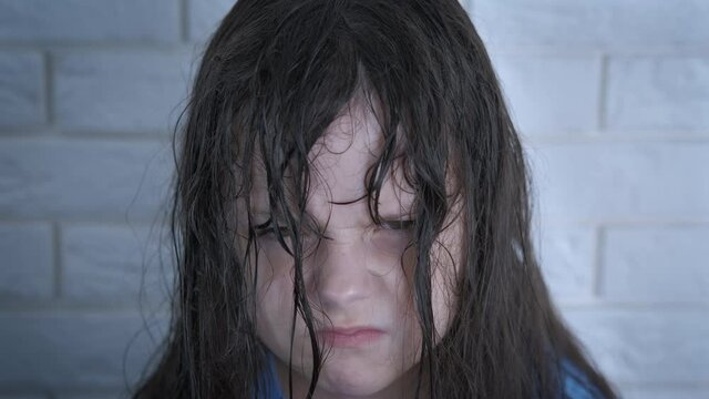 Cranky emotion. A child with cranky emotions stay in the room.