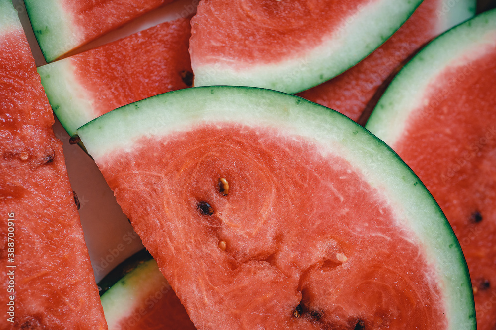 Wall mural bright red fresh watermelon slices top view.