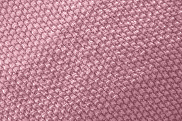 Fototapeta premium Knitted texture in pink color. Close up.
