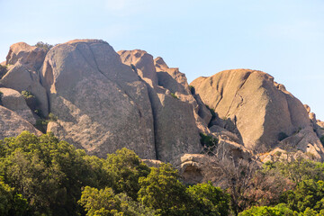 Near the forest is a big rock on the mountain in Corsica. Landscape photography