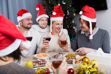 Big happy family celebrating Christmas, enjoying dinner at home