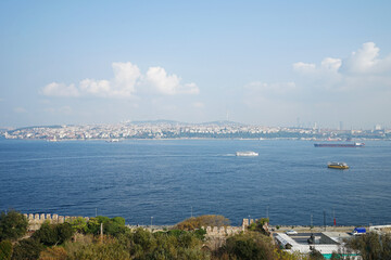 Fototapeta premium Turkish cityscape and seascape of Bosphorus, natural strait connecting the Black Sea to the Sea of Marmara- Istanbul, Turkey