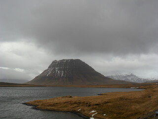 Hiking in the dark and dramatic nature of Iceland's volcanoes, mountains, fjords, geysers and waterfalls