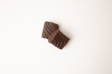 small square chocolate cake on white background