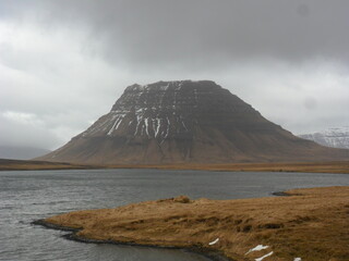 Hiking in the dark and dramatic nature of Iceland's volcanoes, mountains, fjords, geysers and waterfalls