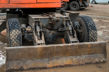 Wheel excavator close-up. Detailed fragment. Construction engineering. Axle. Ust-Kamenogorsk (Kazakhstan)