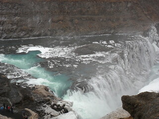 Hiking in the wild and dramatic landscapes of Iceland's snowy mountains, volcanoes, geysers, waterfalls and hot springs