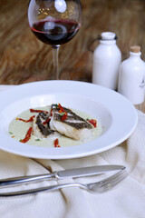 Halibut fillet in cream sauce.