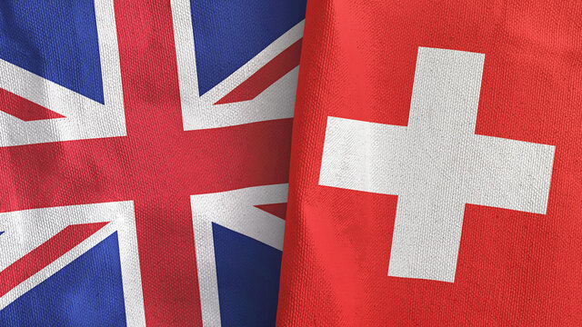 Switzerland and United Kingdom two flags textile cloth 3D rendering
