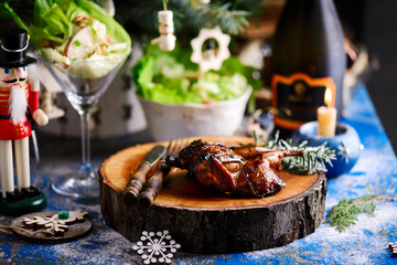 Honey-glazed quail with Waldorf salad  in a Christmas decor.