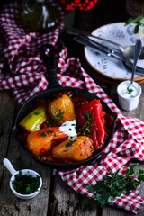 Peppers stuffed with meat and rice in tomato sauce..selective focus