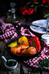 Peppers stuffed with meat and rice in tomato sauce..selective focus
