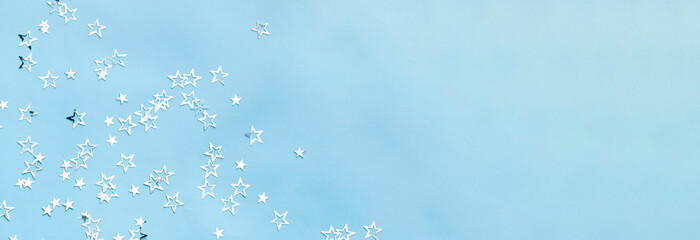 multiple silver stars on blue background banner