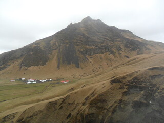 Hiking in the wild and dramatic nature among volcanoes, geysers, waterfalls, snowy mountains and hot springs in Iceland