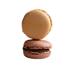 Caramel and chocolate tasty french macaroons on white isolated background