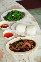 Herb stewed pork legs and mantou are famous dishes of Doi Mae Salong, Thailand.
