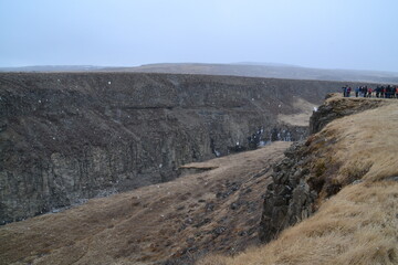 Hiking in the wild and dramatic nature of volanoes, snowy mountains, waterfalls, geysers and hot springs in Iceland