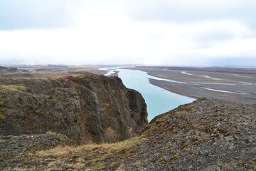 Hiking in the wild and dramatic nature of volanoes, snowy mountains, waterfalls, geysers and hot springs in Iceland