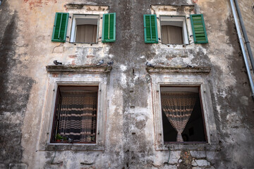 Fototapeta na wymiar Montenegro - Front wall of an ancient residential building in Kotor Old Town