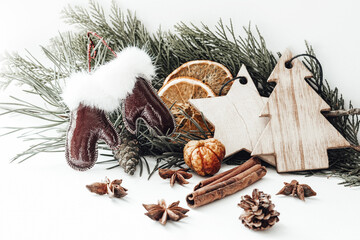 Christmas composition with fir tree branch, new year toys, dried fruits cinnamon and star anise. Photo
