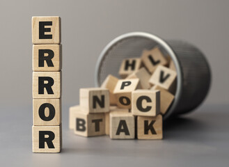 The word ERROR made from wooden cubes. Shallow depth of field on the cubes