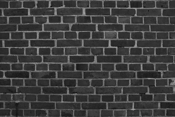 Fototapeta na wymiar stone wall made of bricks monochrome